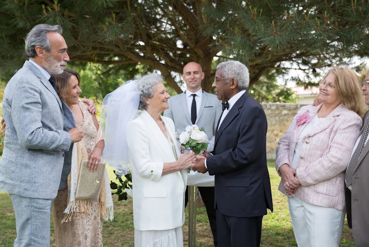 Guests Watching A Couple Get Married