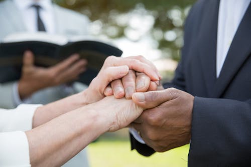 Free Man and Woman Holding Hands Stock Photo