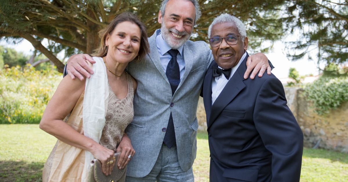 diverse group of seniors laughing outdoors, healthy aging lifestyle