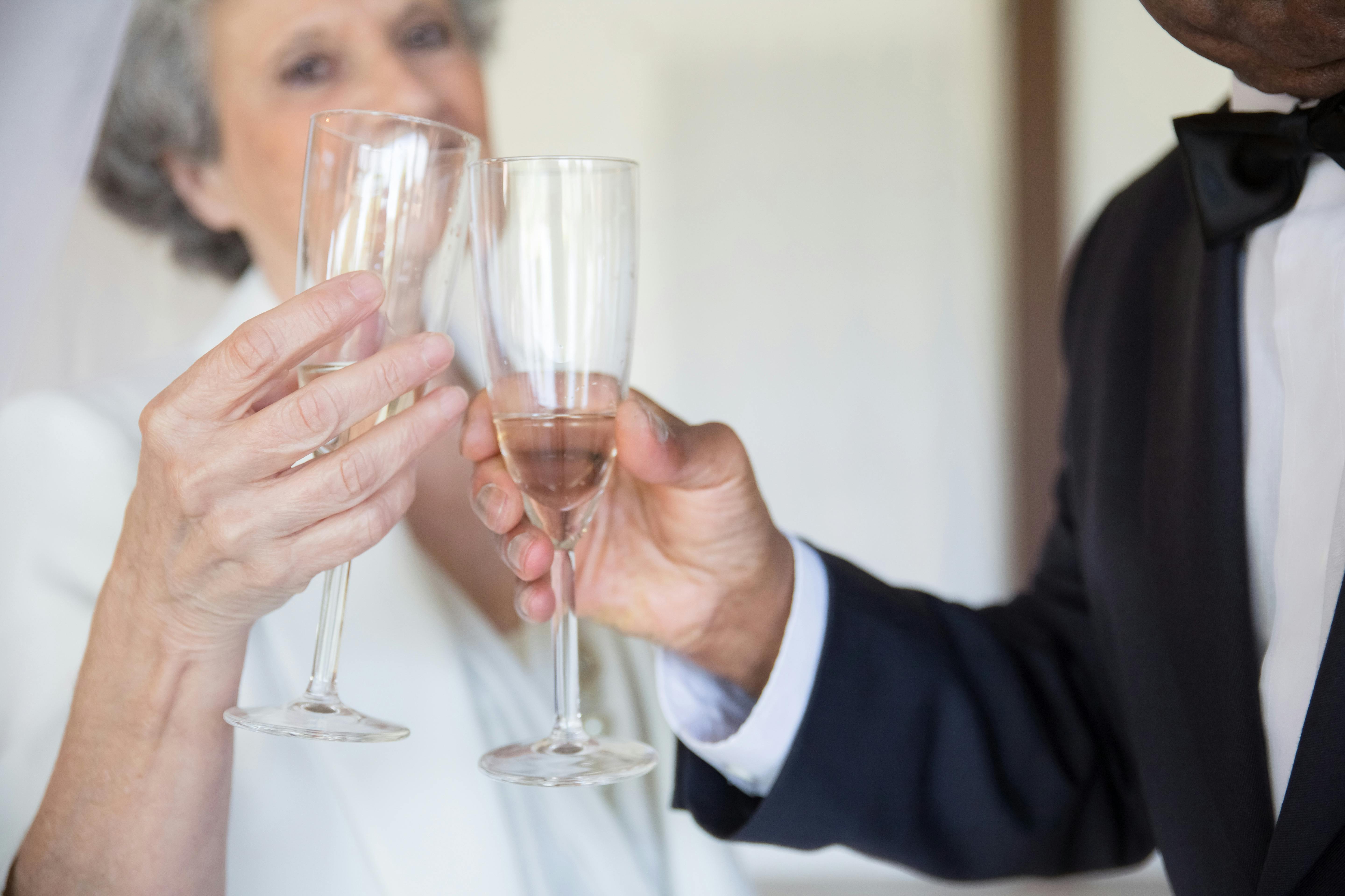 People holding glasses of champagne making a toast Stock Photo by ©dasha11  57270549