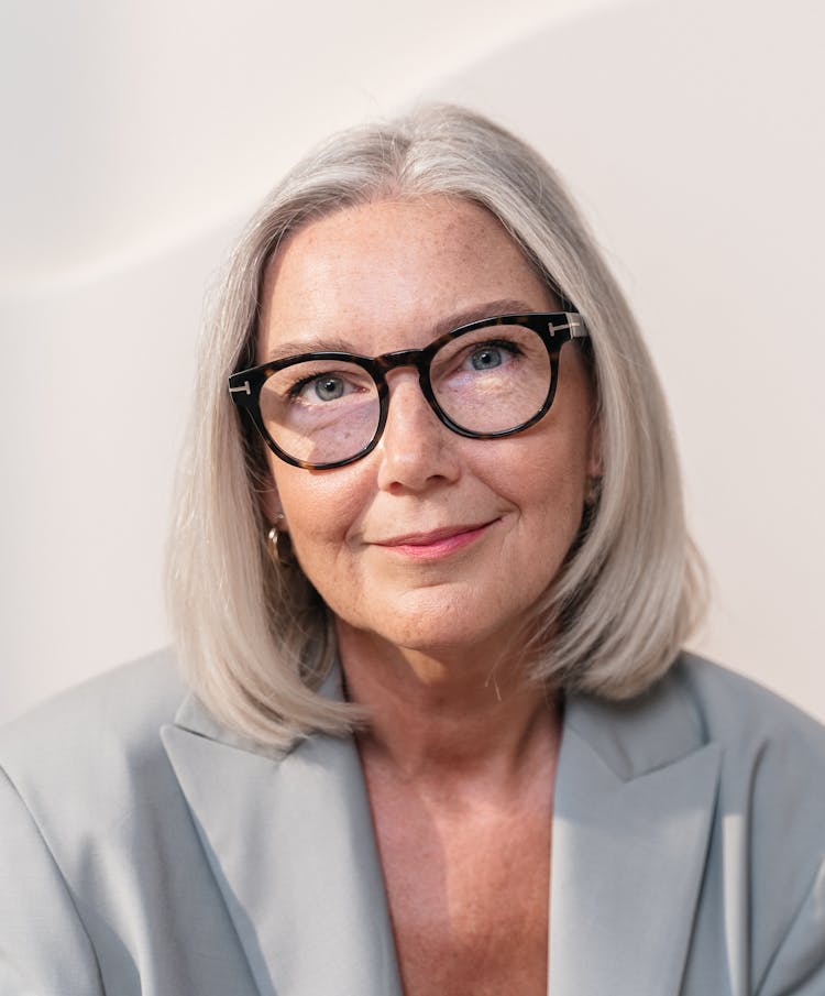 Portrait Of Beautiful Elderly Woman In Glasses