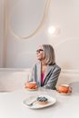 Woman in Gray Blazer Having Coffee