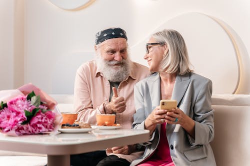 Smiling Couple Sitting Together 