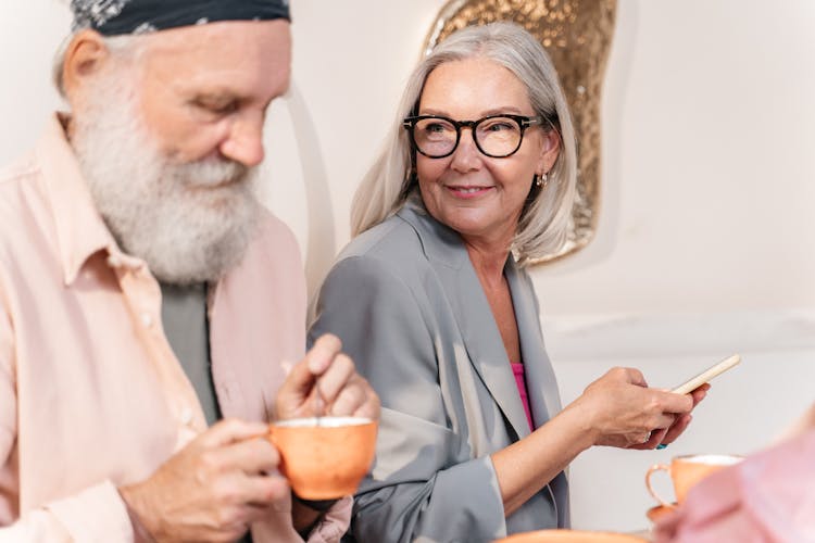 Happy Elderly Couple Drinking Tea At Home