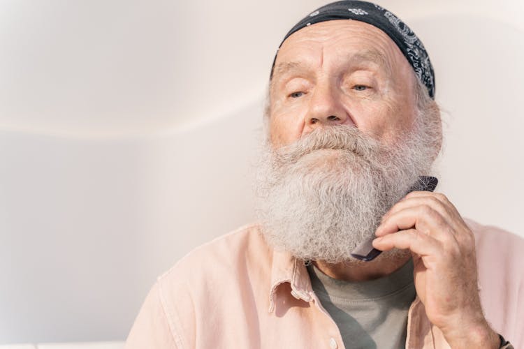 A Man Combing His Beard 