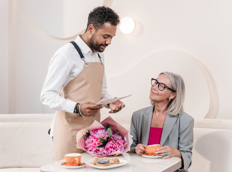 Waiter And Woman Talking