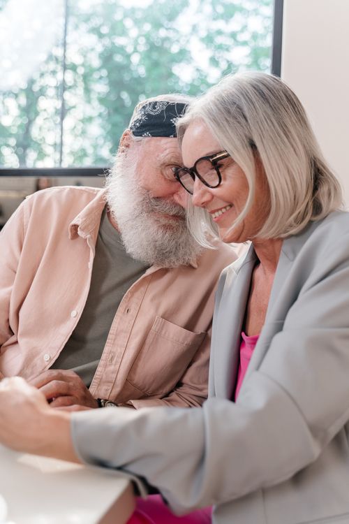 Free Senior couple sharing a joyful moment indoors, highlighting love and companionship. Stock Photo