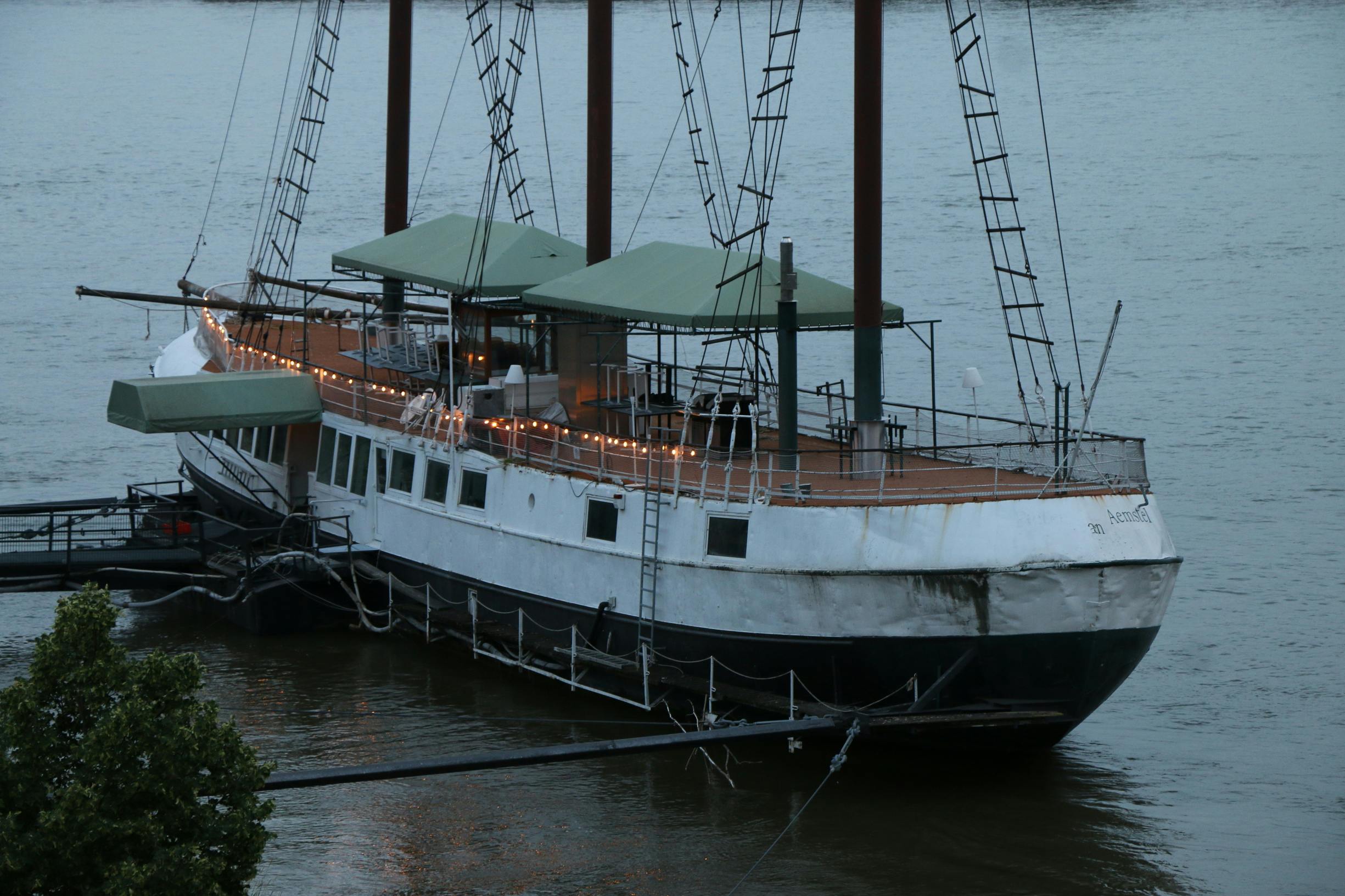 AI engineer monitoring model safety metrics on multiple screens in a dimly lit lab