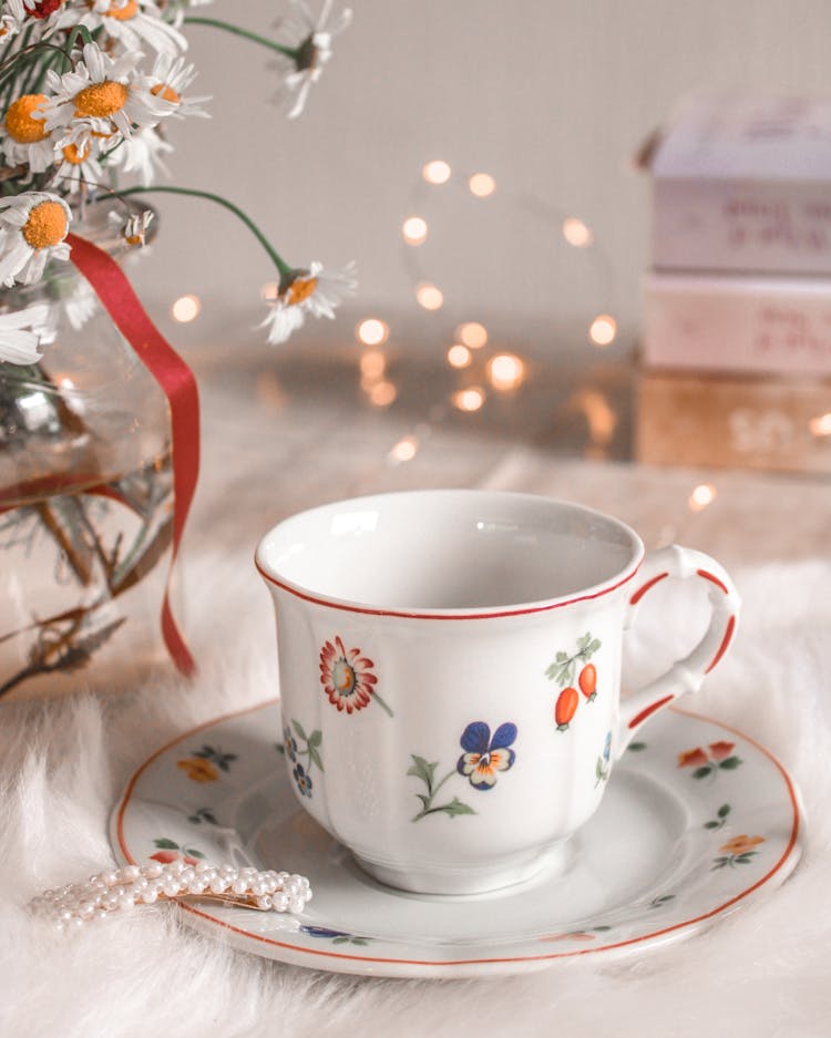 White Floral Ceramic Teacup On Saucer