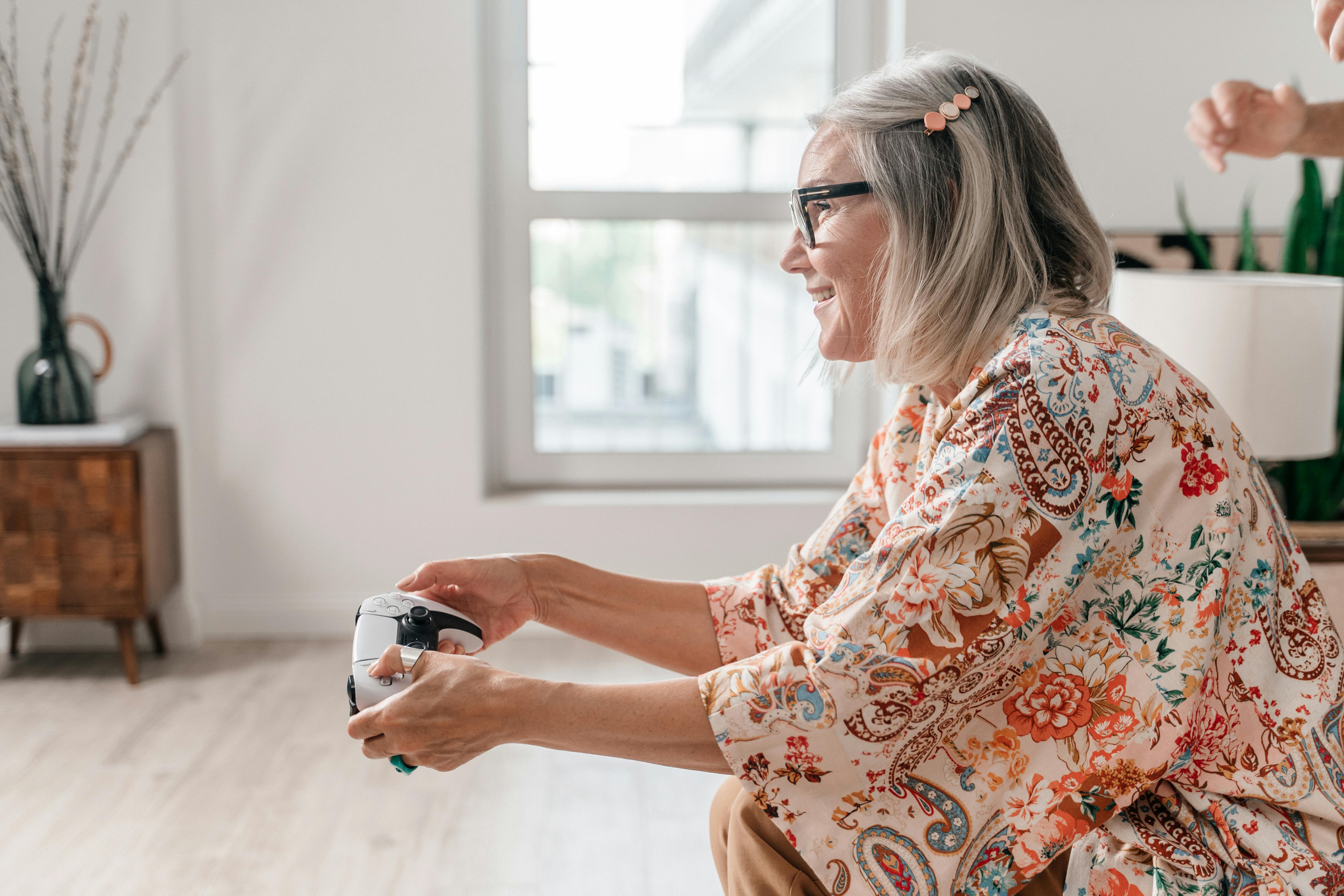 an elderly woman playing a video game