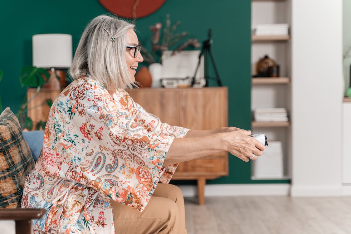 An Elderly Woman Holding a Game Controller