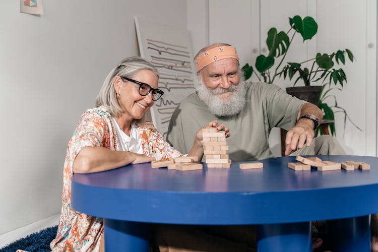 Man And Woman Playing Jenga 