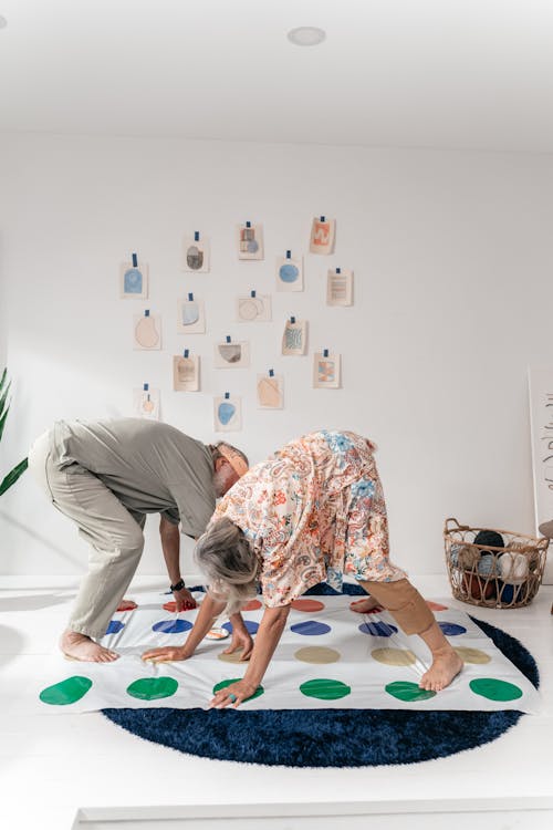 Free An Elderly Couple Playing with Gaming Floor Mat Stock Photo