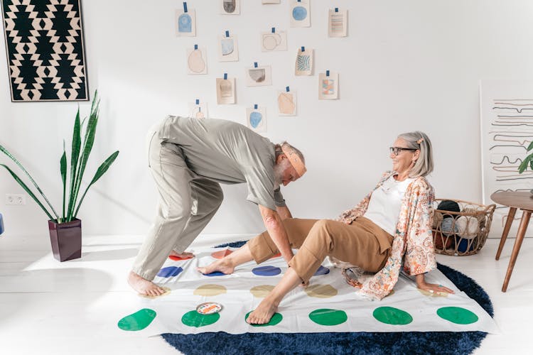 Elderly Couple Playing With A Gaming Mat