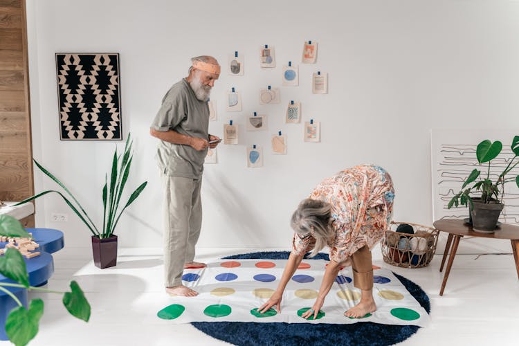 Elderly Couple Playing On A Gaming Mat