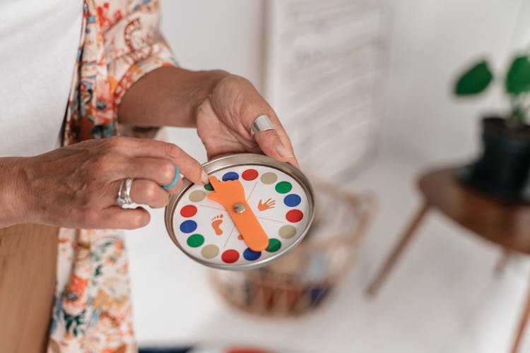 Woman Hands With Twister Board