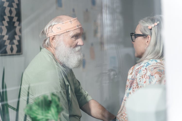 Elderly Couple Seen Through Window