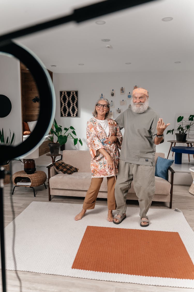 Elderly Couple Filming Video For Social Media