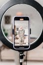 Elderly Man Making Video for Social Media Using Ring Light