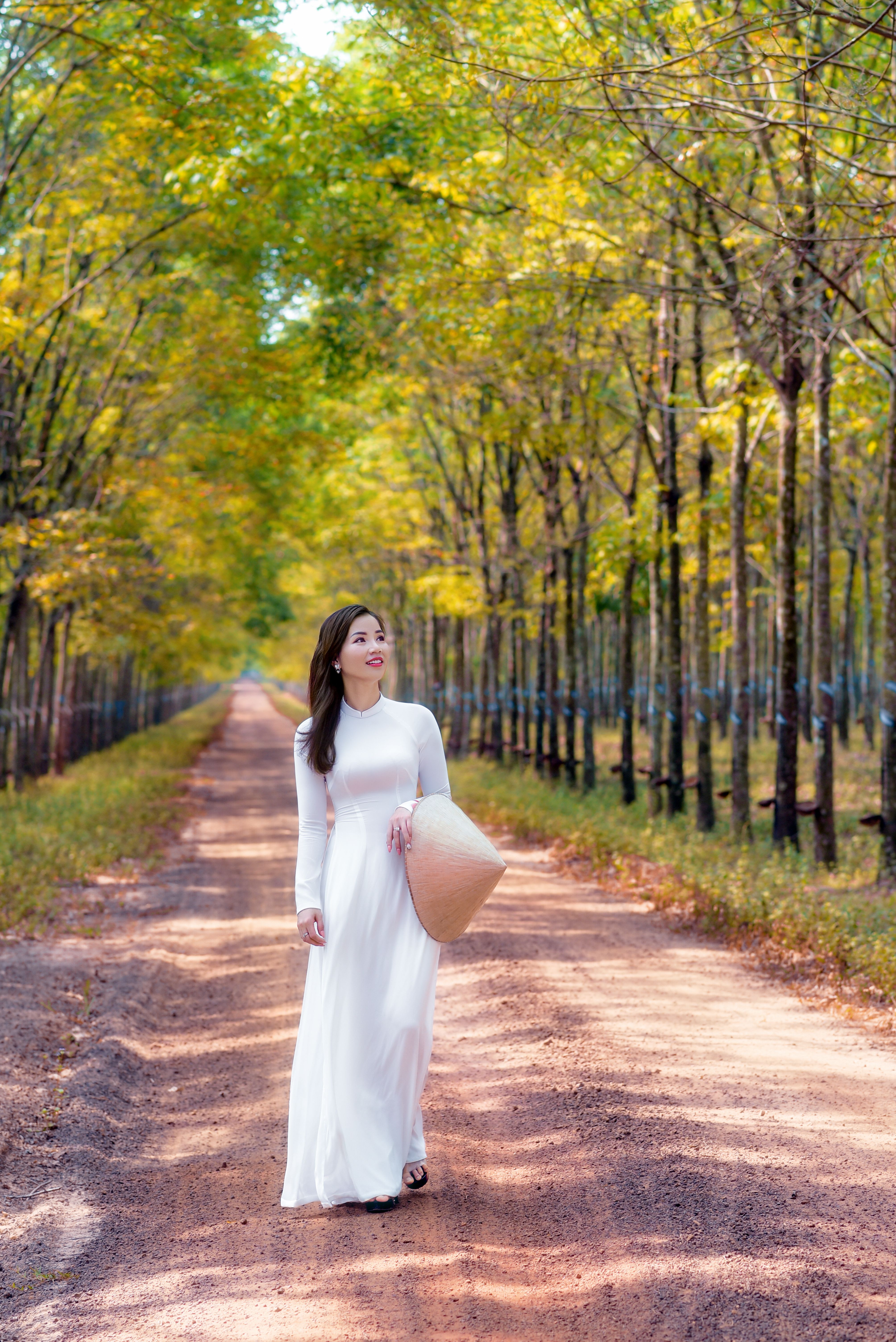 A Woman Wearing a White Dress and Hat · Free Stock Photo
