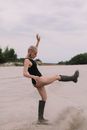 Woman in Black Sports Bra and Black Shorts Doing Yoga