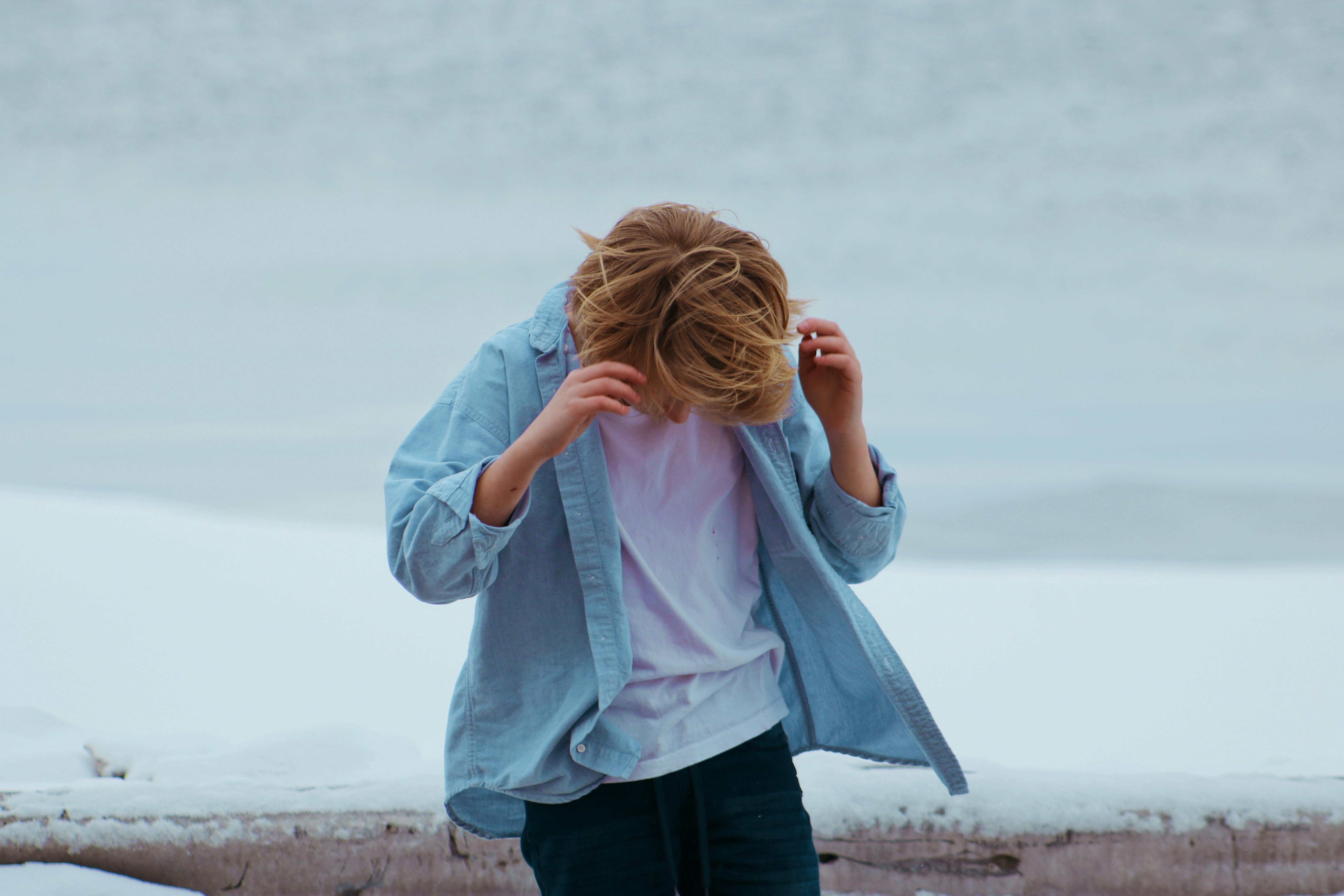 person in blue button up shirt and blue bottoms