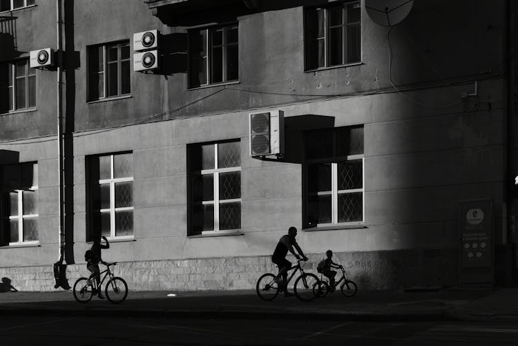 Silhouettes Of People Riding Bicycles