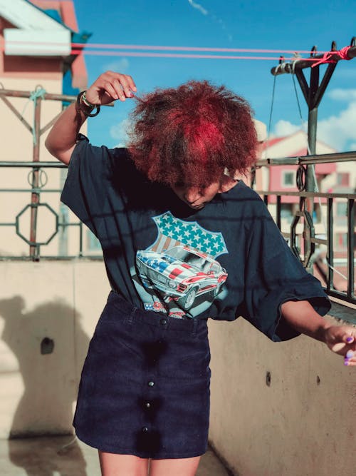 Woman with Red Curly Hair Dancing