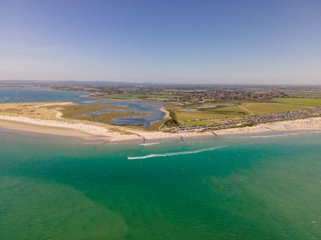 A drone's perspective of West Wittering Beach, capturing the vibrant coastline and serene sea in the United Kingdom.