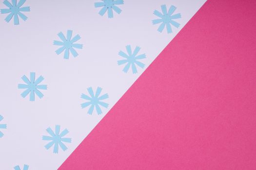 A modern pink and blue geometric design featuring snowflake patterns, perfect for seasonal backgrounds.