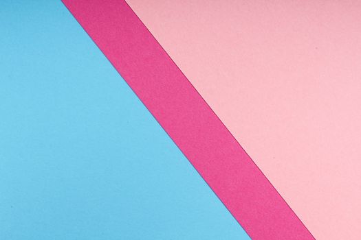Vibrant abstract geometric image featuring blue, pink, and pastel colors on paper.