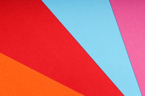 Overlapping sheets of coloured paper forming a geometric pattern — Tamanna Rumee on Pexels
