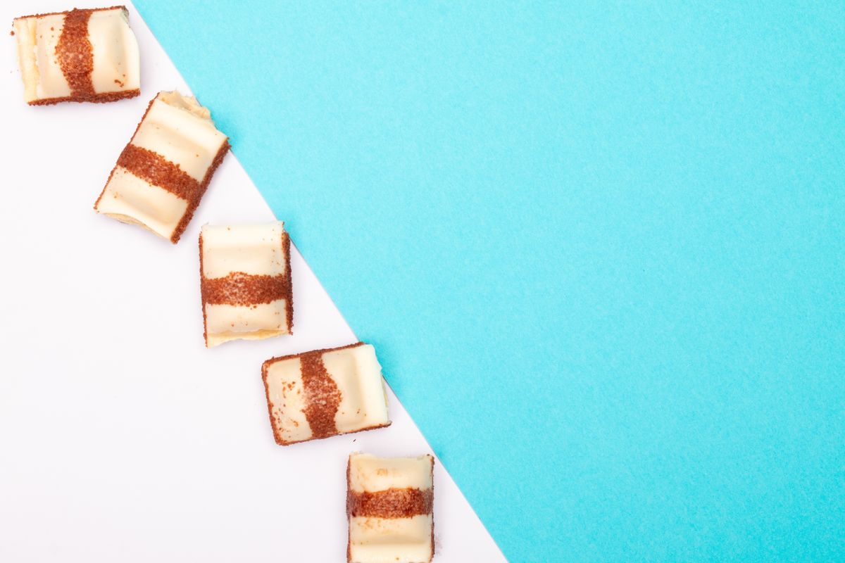 Abstract layout of sweets on a blue and white background, perfect for copyspace.