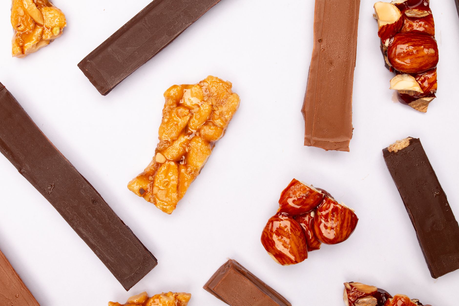 chocolate caramel shortbread bars sliced on white plate