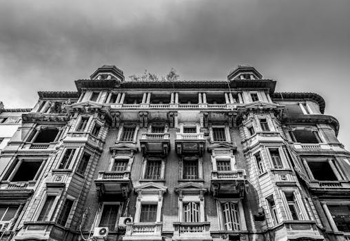 Low angle view of historic architectural facade in black and white, Cairo, Egypt.