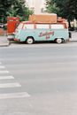 White and Orange Van on Road