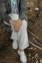 Woman in Gray Cardigan and White Dress