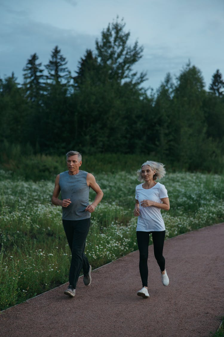 Elderly Couple Jogging Together