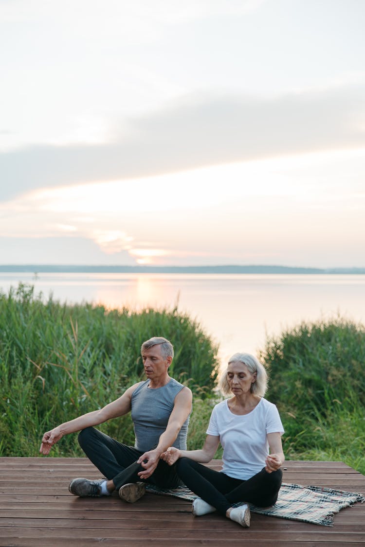 Elderly Couple Doing Yoga 