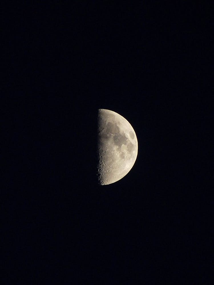 Half Of Moon On Black Sky