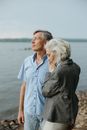 Man and Woman Standing Near Body of Water