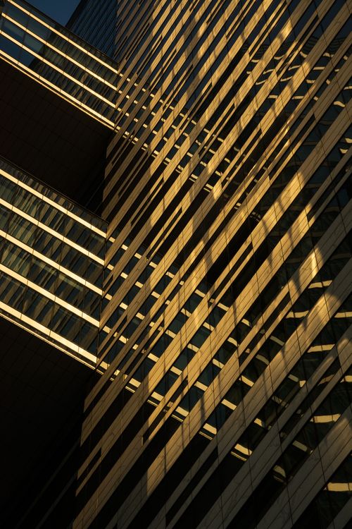 Free Dynamic low angle shot highlighting geometric patterns in an urban building facade. Stock Photo