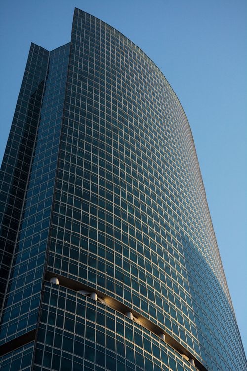 Blue Glass Walled High Rise Building · Free Stock Photo