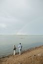 Man and Woman Walking on Beach