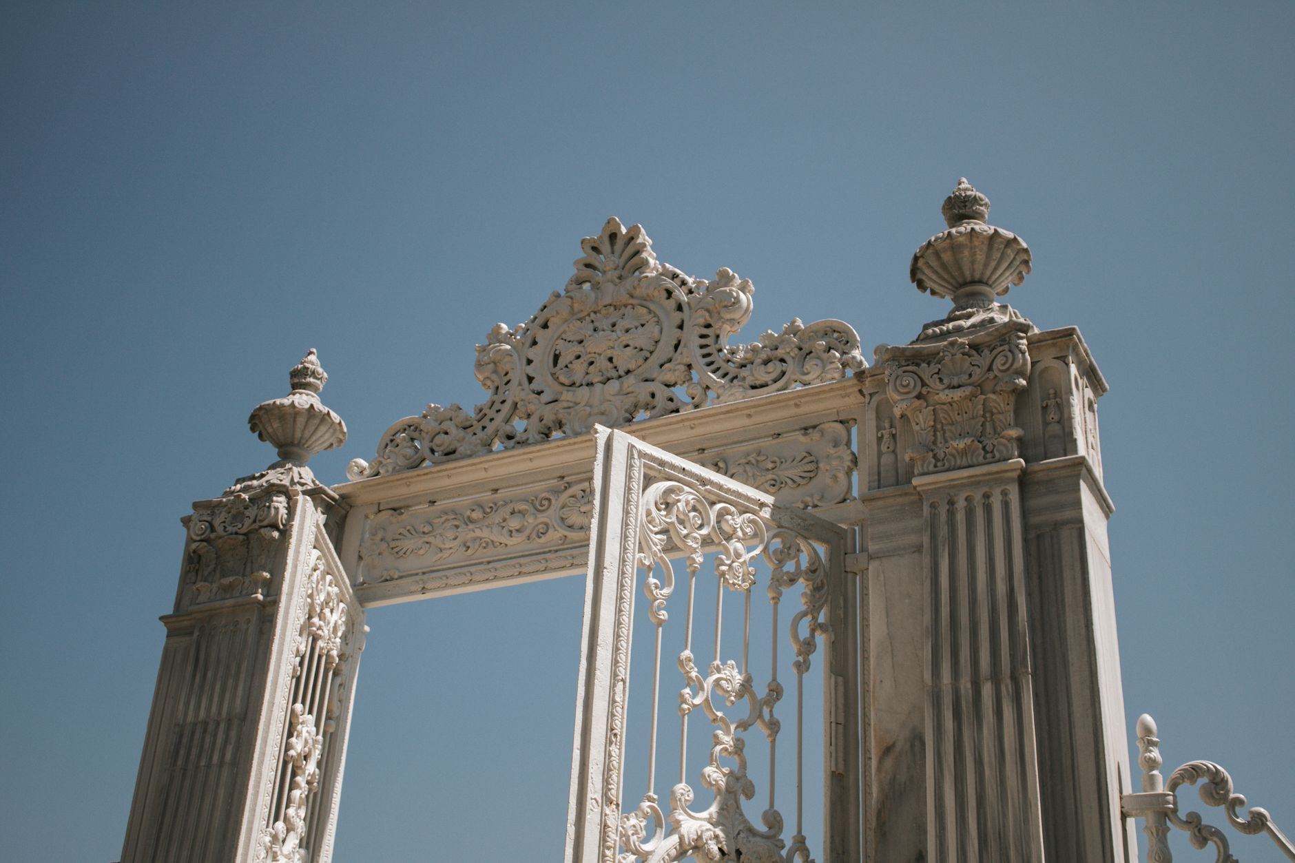 Ornate gate of Dolmabahçe Palace showcasing Ottoman architecture in Istanbul, Turkey.