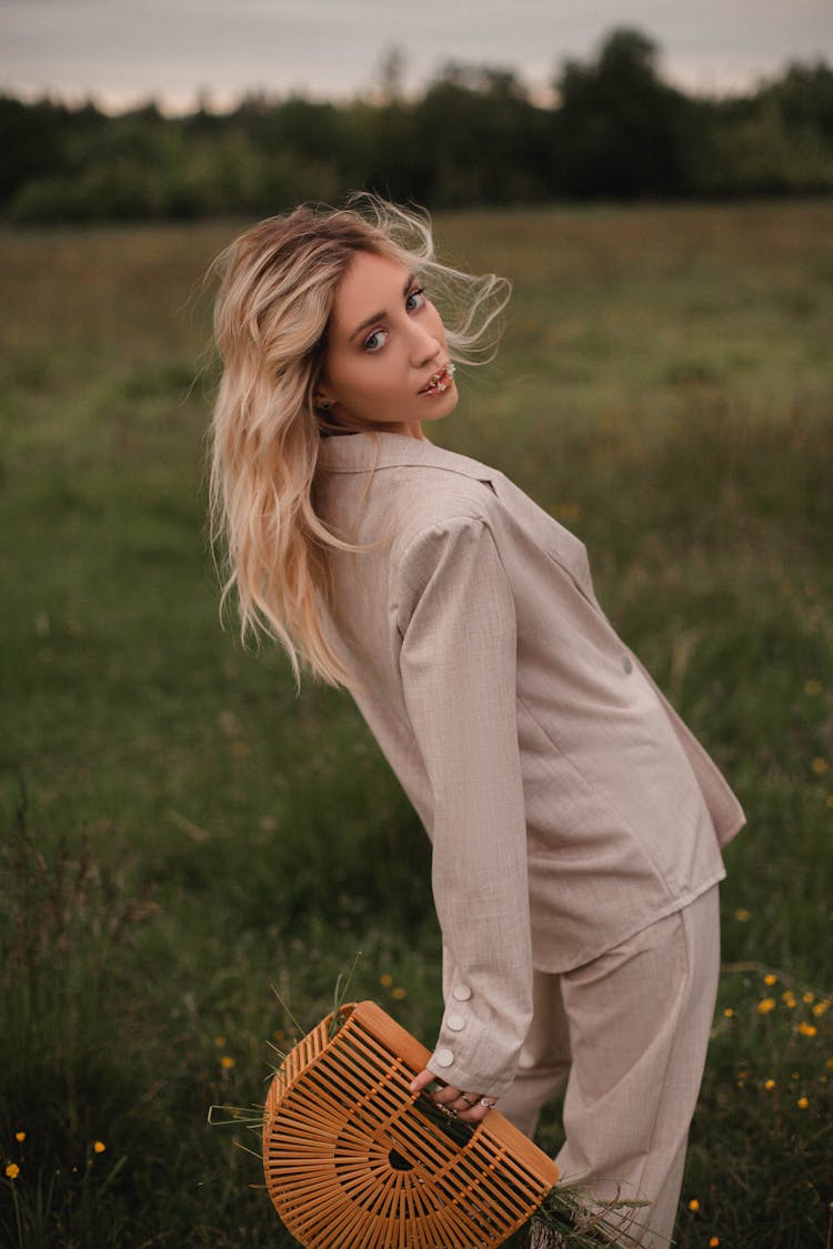 Close-Up Shot Of A Blonde Woman Wearing A Beige Suit