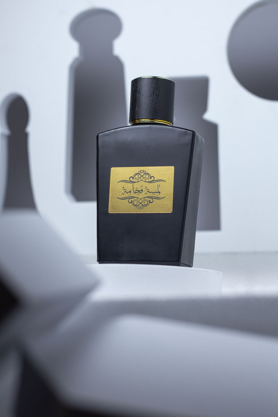 Black and gold perfume bottle