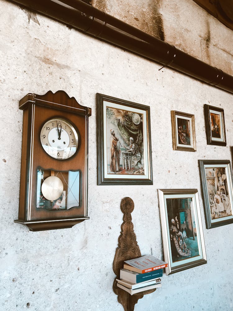 Antique Clock And Paintings On Wall