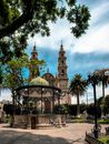 A Garden Kiosk with a Background of Our Lady of the Assumption Church in Lagos de Moreno, Jalisco, Mexico