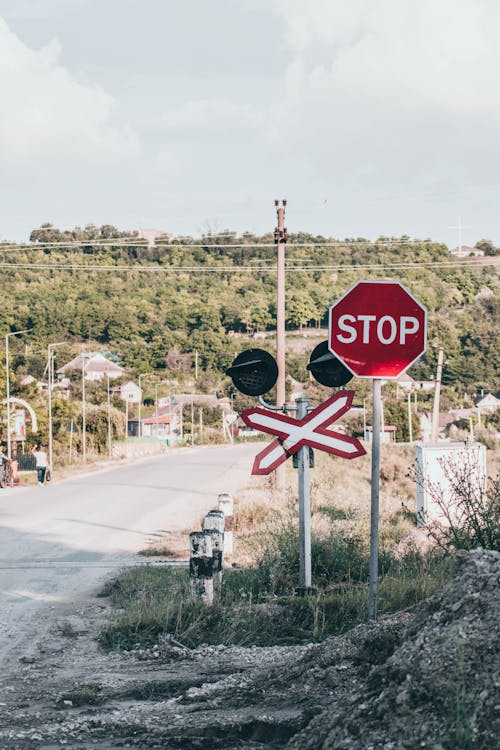 Free A Red and White Stop Sign on a Level Crossing Stock Photo